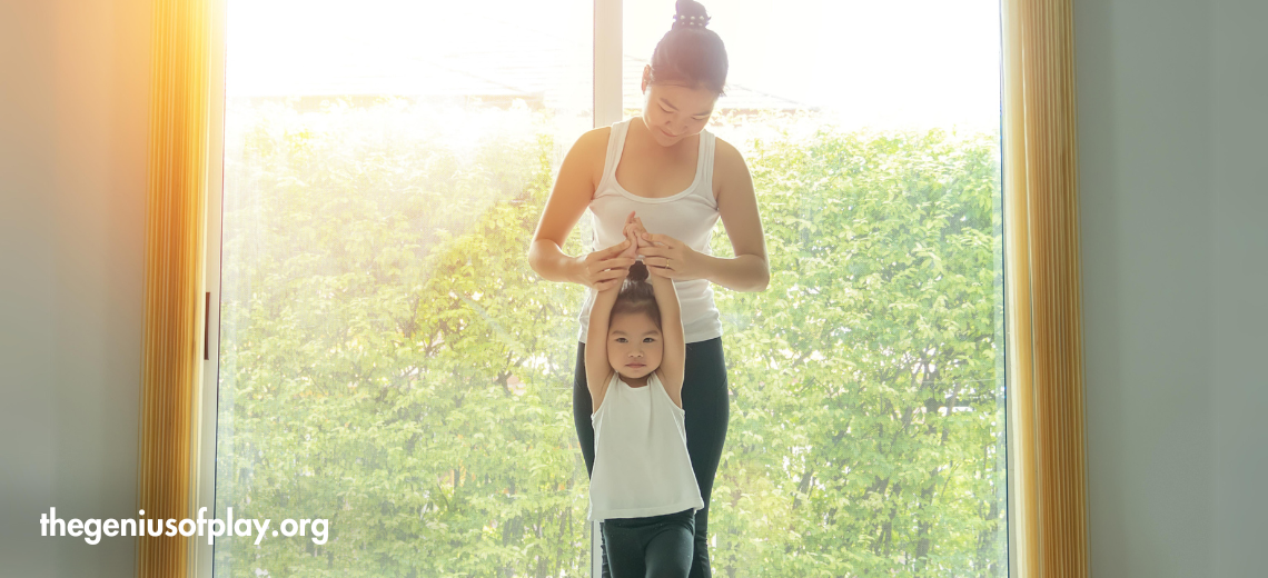 Mom and young daughter working out doing exercise at home 
