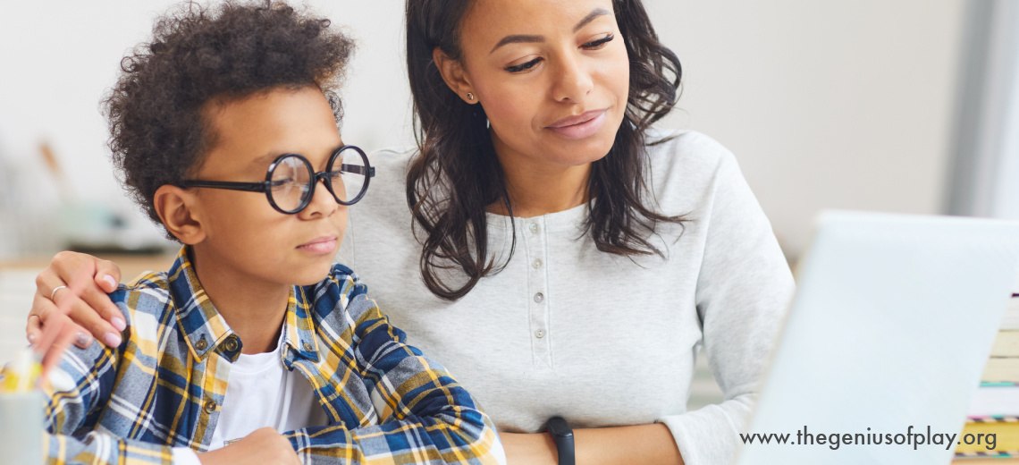 African American Mom and Son using Laptop to Learn at Home