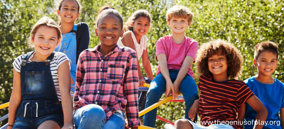 multi-cultural preteen kids playing on a jungle gym in a playground