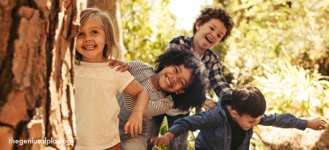 multi-cultural diverse young kids playing in nature in a forest