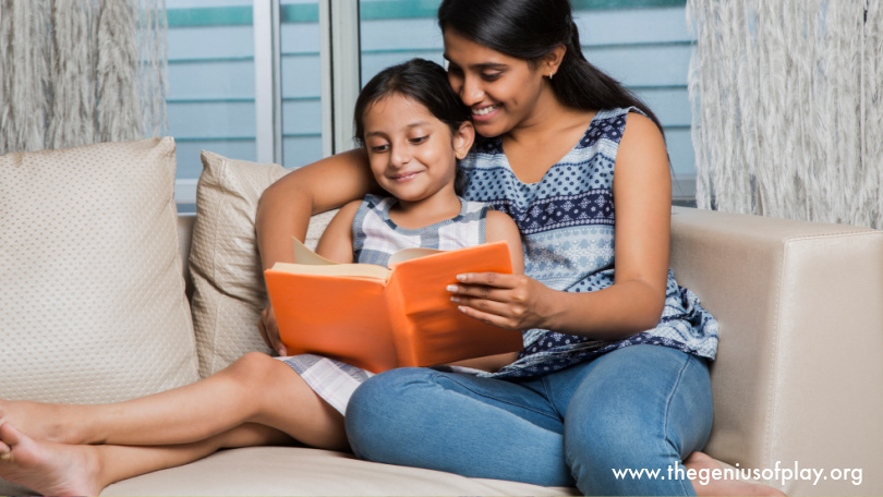 mother and daughter reading a book together