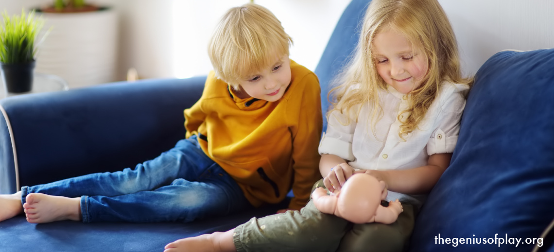 young pre-school aged boy and girl caring for and playing with a doll