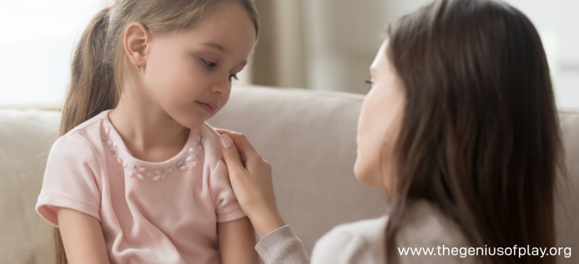 Mom talking to upset young girl