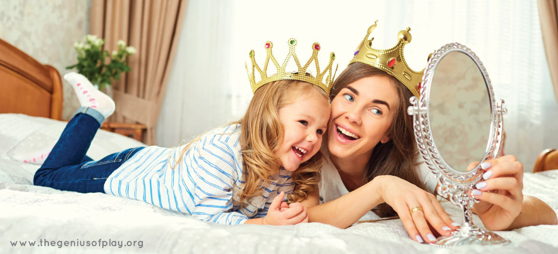 mother and daughter looking in mirror