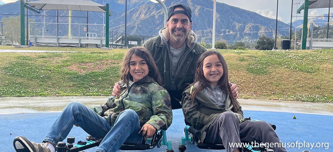 Dad and tween aged kids smiling on go carts